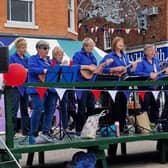 Members of Melstrum Ukulele Orchestra entertaining audiences in Melton Market Place