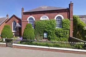 The historic yew trees visible in the grounds of the property in Main Street, Great Dalby