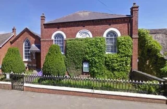 The historic yew trees visible in the grounds of the property in Main Street, Great Dalby
