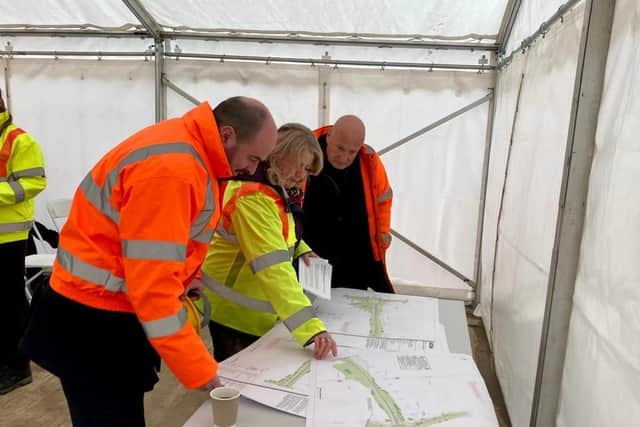 Road Minister Richard Holden examines a route map in Melton to see work start on town's partial bypass
