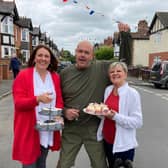 Craven Street residents Amanda, Yvonne and Dave enjoy a street party for the Platinum Jubilee