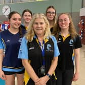 Melton Swimming Club coach Tracy McGhie with some of the club's talented young swimmers