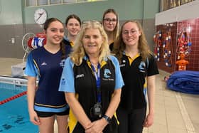 Melton Swimming Club coach Tracy McGhie with some of the club's talented young swimmers