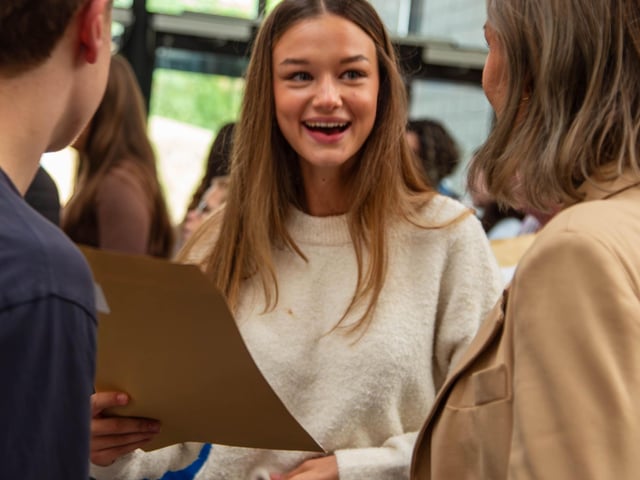 Students sharing their GCSE results.