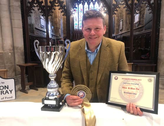 Piemaker Ian Jalland celebrates after Brockleby's Pies won the Supreme Champion title at the British Pie Awards 2023 their Moo and Blue pie