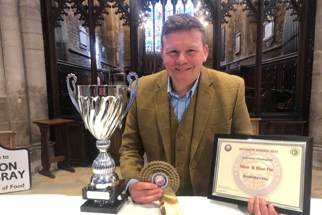 Piemaker Ian Jalland celebrates after Brockleby's Pies won the Supreme Champion title at the British Pie Awards 2023 their Moo and Blue pie