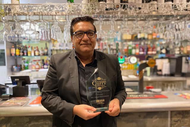 Atul Dawda proudly shows off the county fine dining restaurant of the year award his SOI Indian Restaurant won at the Leicestershire Curry Awards 2025