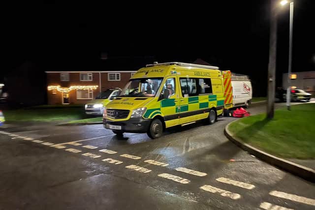 An ambulance crew waits in the Blakeney Crescent area on Monday evening during the 12-hour police stand-off
Photo George Icke
