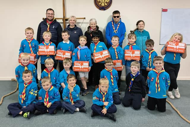 Members of the 4th Melton Mowbray Livingston Beaver Scout Colony with the festive shoeboxes they have filled for the T4U charity