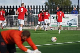 Melton Town celebrate their equaliser on Saturday.