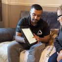 Green Doctor Fayad and Neena looking at online information to save money.