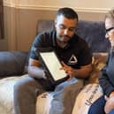 Green Doctor Fayad and Neena looking at online information to save money.