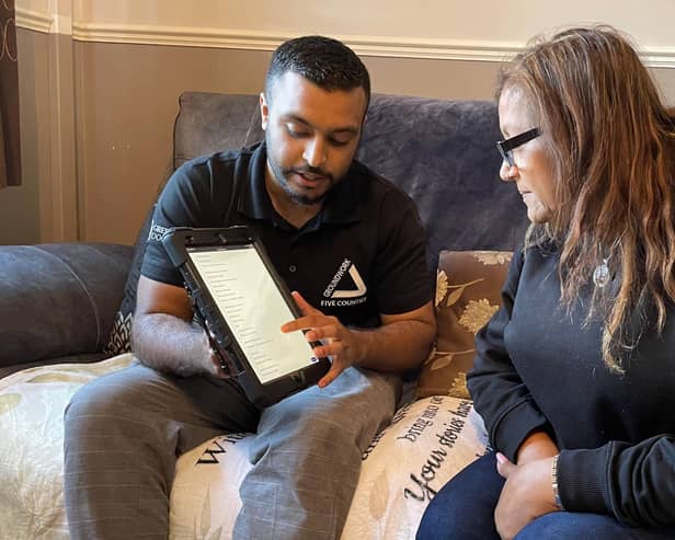 Green Doctor Fayad and Neena looking at online information to save money.