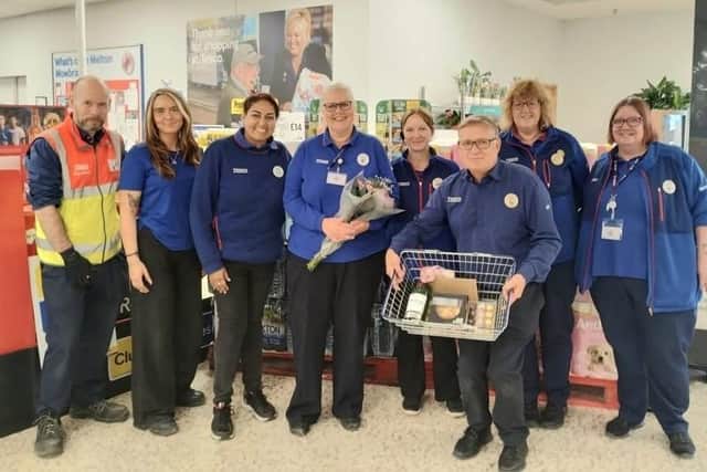Becky Woodward (centre) with colleagues at her leaving presentation at the Melton Mowbray Tesco store