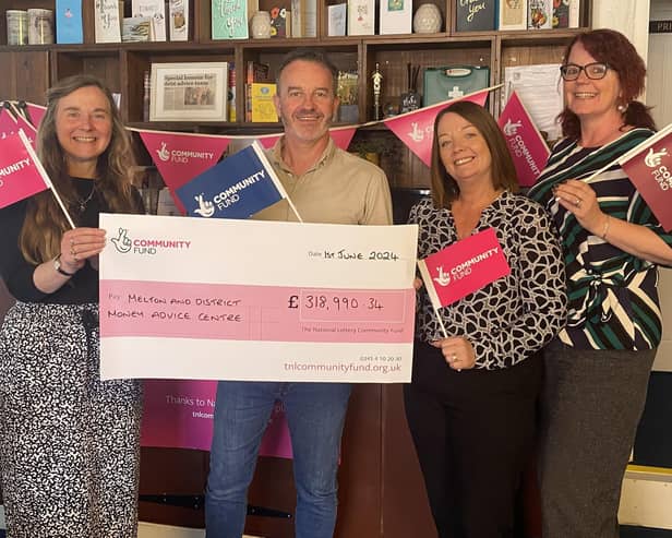 Members of the team at Melton and District Money Advice Centre (MADMAC) celebrate with a cheque for the funding given to them by the National Lottery Community Fund, from left: Deborah Williams - Money Mentor, Richard Coombs - Volunteer Debt Adviser, Michelle Ainge - Debt Adviser, Amanda Heath - Founder