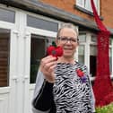 Lynne Jeffery shows off her stunning Poppy memorial in Welby Lane, Melton Mowbray