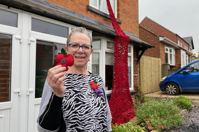 Lynne Jeffery shows off her stunning Poppy memorial in Welby Lane, Melton Mowbray