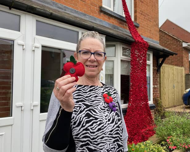 Lynne Jeffery shows off her stunning Poppy memorial in Welby Lane, Melton Mowbray