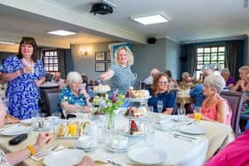 Members of the Melton Parkinson's support group enjoy afternoon tea courtesy of Barratt Homes