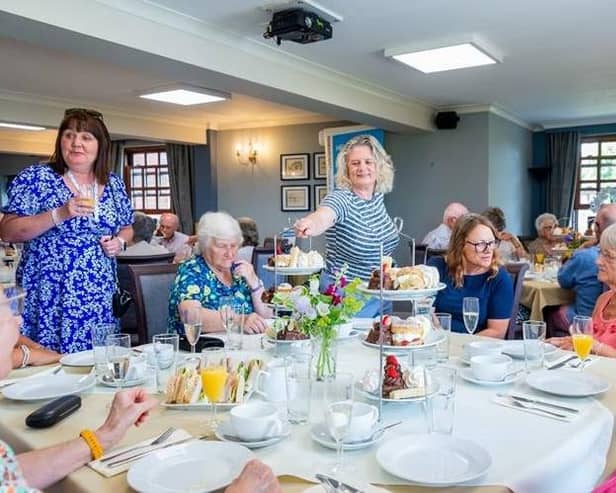 Members of the Melton Parkinson's support group enjoy afternoon tea courtesy of Barratt Homes