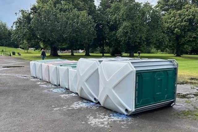 The vandalised portable toilets lying on their side on Play Close Park, Melton, on Sunday morning