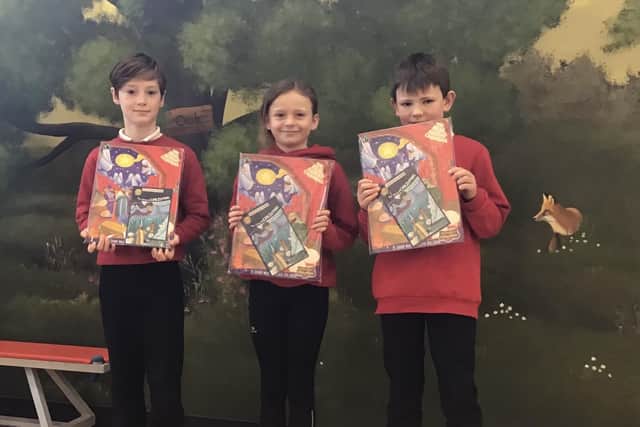 The top three in the Ironstone Villages Family of Churches Christmas card competition entered by Waltham Primary School pupils - from left, Grayson Brooks, age 7 (2nd Prize); Florence Jordan, age 10 (1st Prize); and George Benton, age 8 (3rd Prize)