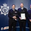 Pc Shane Sanderson gets his award with (left) Andy Spence, of the Leicestershire Police Federation, and former Chief Constable Rob Nixon