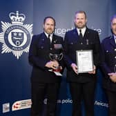 Pc Shane Sanderson gets his award with (left) Andy Spence, of the Leicestershire Police Federation, and former Chief Constable Rob Nixon
