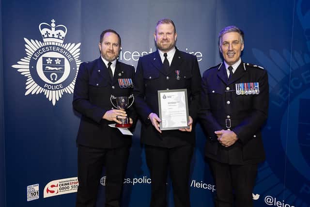 Pc Shane Sanderson gets his award with (left) Andy Spence, of the Leicestershire Police Federation, and former Chief Constable Rob Nixon
