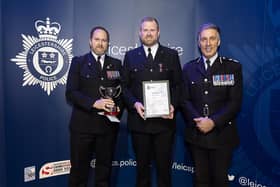 Pc Shane Sanderson gets his award with (left) Andy Spence, of the Leicestershire Police Federation, and former Chief Constable Rob Nixon