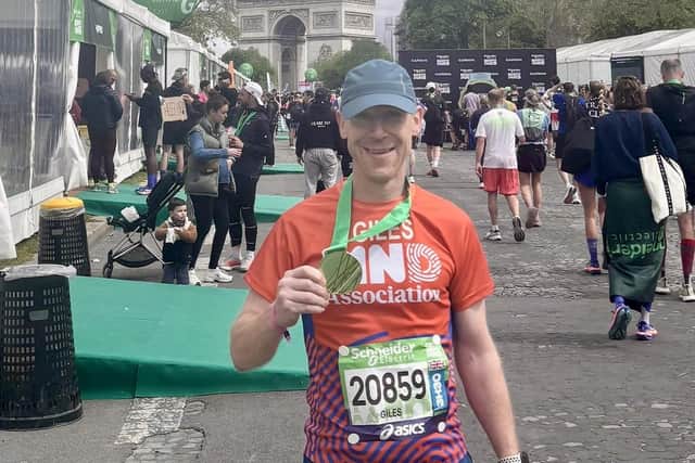 Giles Ashton-Roberts pictured after completing the Paris Marathon this week