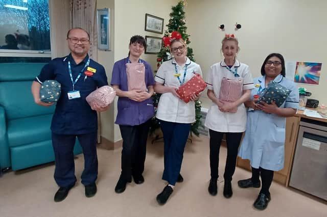 Melton Mowbray Hospital staff with some of the Christmas gifts they are giving to in-patients