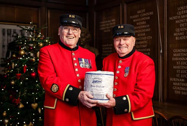 Chelsea Pensioners with Stilton cheese donated by Colston Bassett Dairy as part of an annual historic gesture by the dairy industry