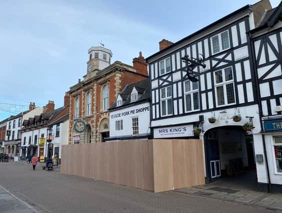 A screen has gone up around Melton's Ye Olde Pork Shoppe as major renovation work starts