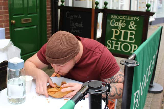 The pie-eating contest during the grand opening of the Brockleby's Pies shop in October 2025