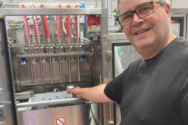 Head brewer Colin Paige on the canning line at Round Corner Brewing in Melton