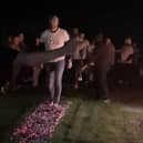 One of the fundraisers walks over red hot coals for Dove Cottage Day Hospice