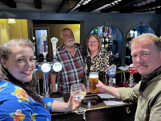 Melton MP Alicia Kearns enjoys a drink on the reopening day at The Bell at Frisby with mine hosts Lucy and Gordon Jackson plus pub operations manager Steve Hardy