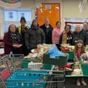 Some of the volunteers who helped distribute 137 food hampers to struggling Melton people last Christmas