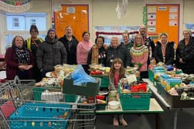 Some of the volunteers who helped distribute 137 food hampers to struggling Melton people last Christmas