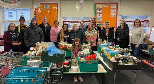 Some of the volunteers who helped distribute 137 food hampers to struggling Melton people last Christmas