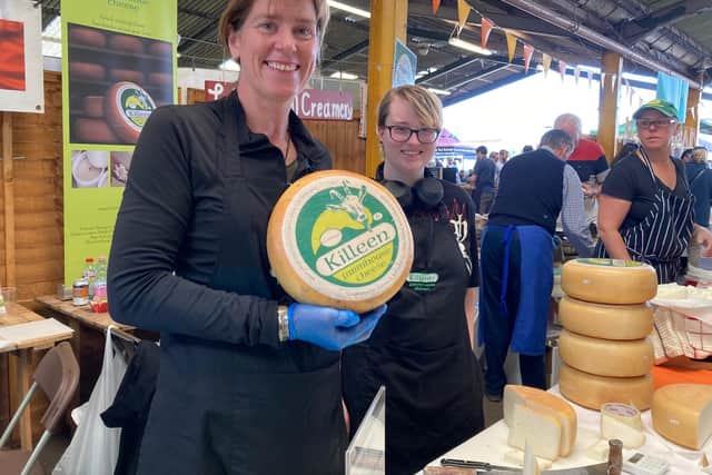 Marion Roeleveld shows off products on the Killeen Farmhouse Cheese stand at last year's Artisan Cheese Fair