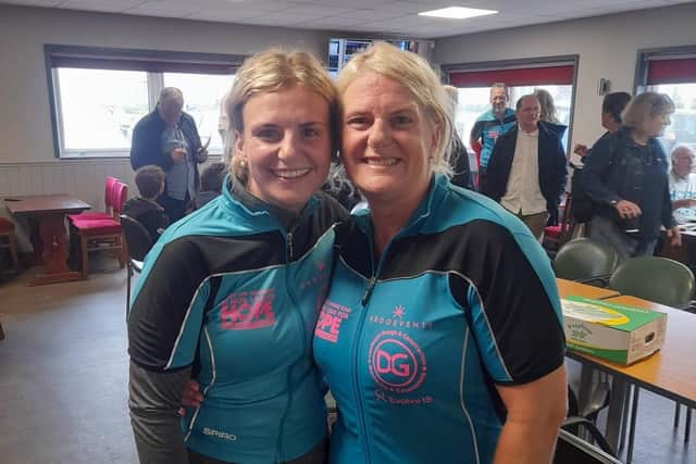 Alice Greaves relaxes in Norfolk with a team member after they raised £85K for cancer research with a cycling fundraiser