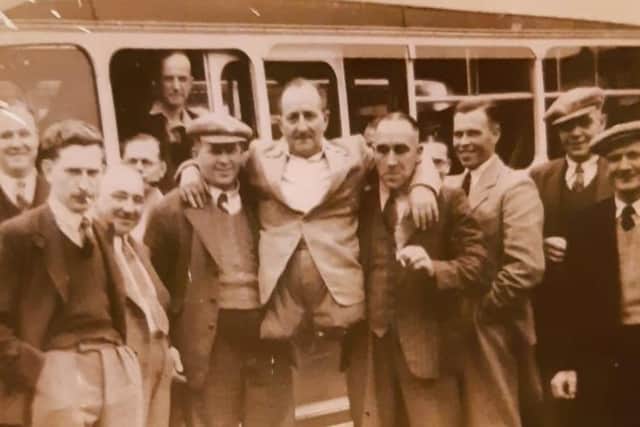 Bill Keightley being carried by friends at Melton Working Men's Club