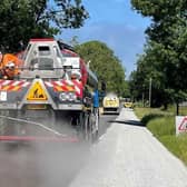 A Leicestershire County Council's highways team carries out summer maintenance on a local road
