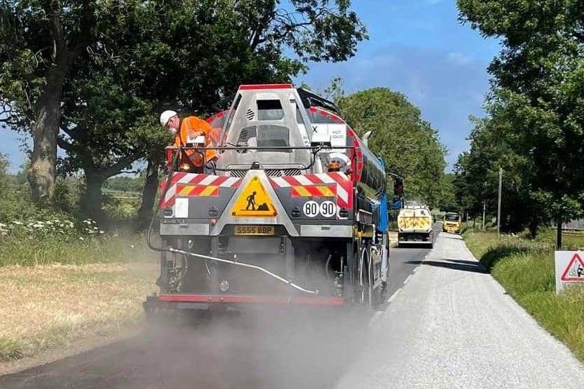 A Leicestershire County Council's highways team carries out summer maintenance on a local road