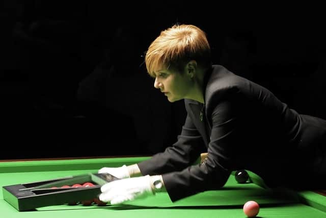 Referee Patricia Murphy sets up the table.