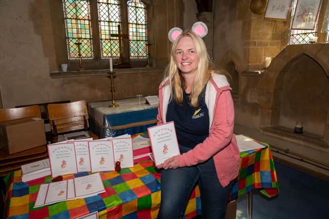 Anna Harrison with her fundraising book - The Tale of the Tumbling Tower of Little Thrussington - at the church event PHOTO Shelley Costello
