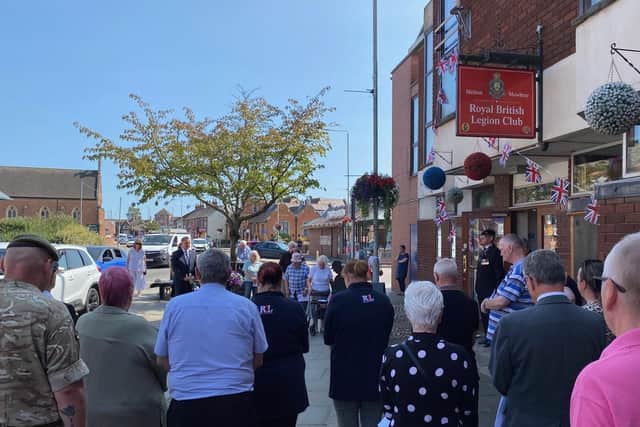 Two minutes of silence are observed for VJ Day outside the legion club in Melton