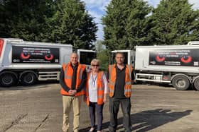 Deputy Melton Borough Council leader, Margaret Glancy, with members of the local bin collection team and lorries with the new signage on